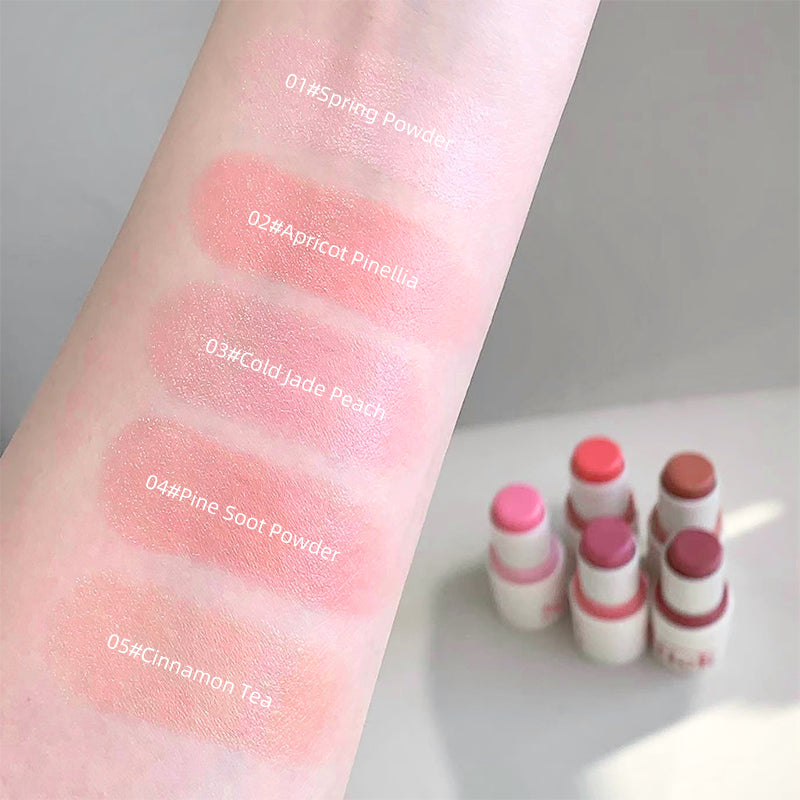Color swatches on a arm with lip balm tubes labeled.
