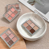 Makeup eyeshadow palettes on a textured surface