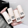 Hand holding four 'GEGE BEAR' highlight stick tubes with a blurred background