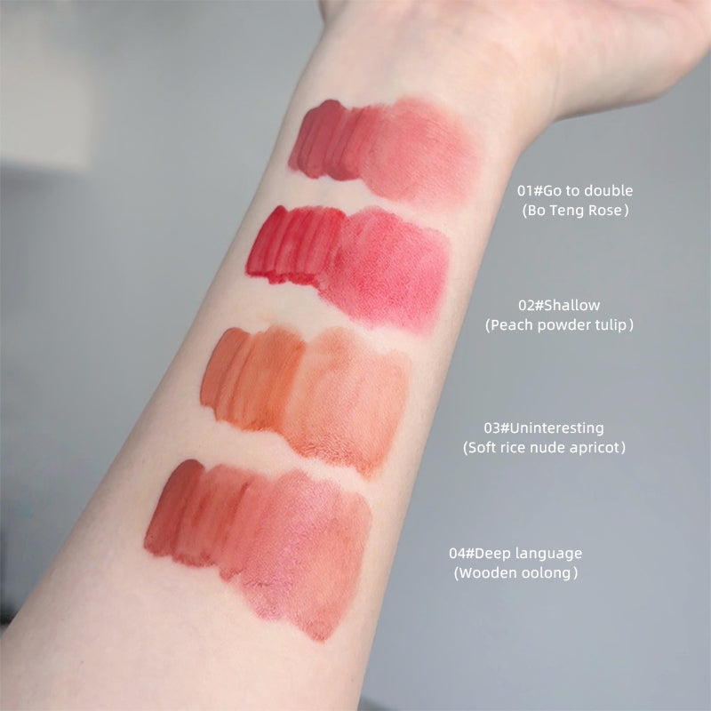 Lipstick swatches on a person's arm with color names and codes.