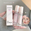 Two GE GE BEAR brightening concealers and their packaging held by a hand.