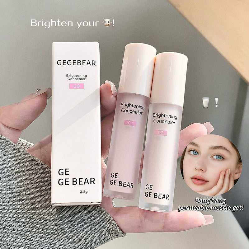 Two GE GE BEAR brightening concealers and their packaging held by a hand.