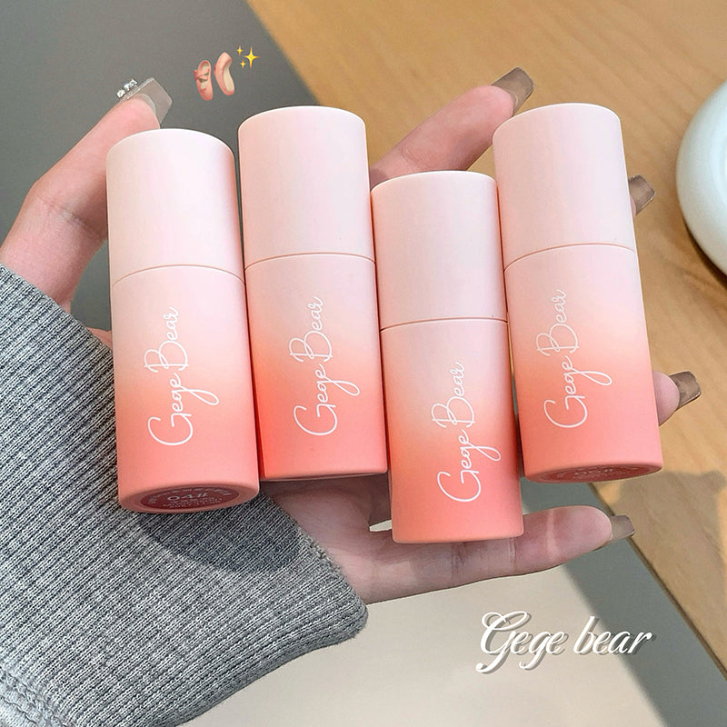 Four gradient lip balms held in a hand, with 'Geye bear' branding.