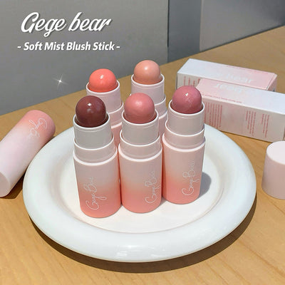 Gege bear soft mist blush sticks on a white stand with a neutral background