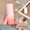 Pink and orange lip balm with 'Bear Bear' branding, held by a hand with decorative nails.