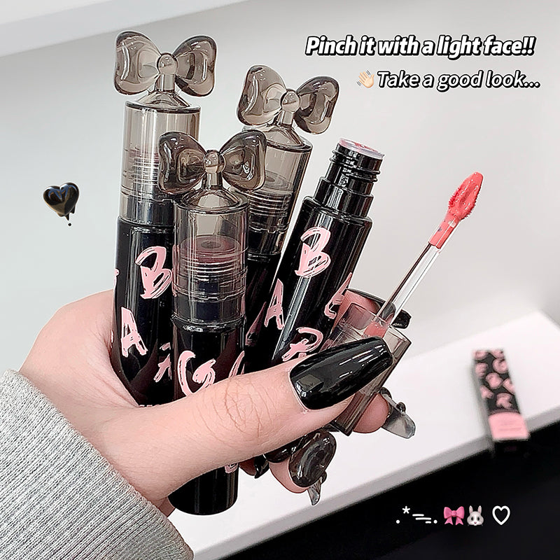 Hand holding makeup products with decorative elements on a light background