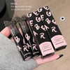 Lip gloss with black and pink design held by a hand, showing 'GEGE BEAR' branding.