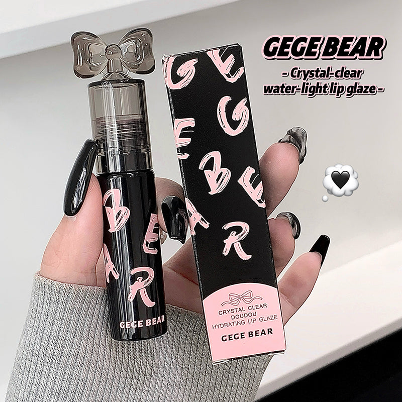 GEGE BEAR lip gloss bottle and packaging held by a hand on a light background