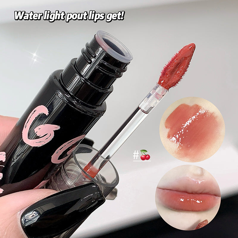 Lip gloss with applicator and close-up of lip color on a white background