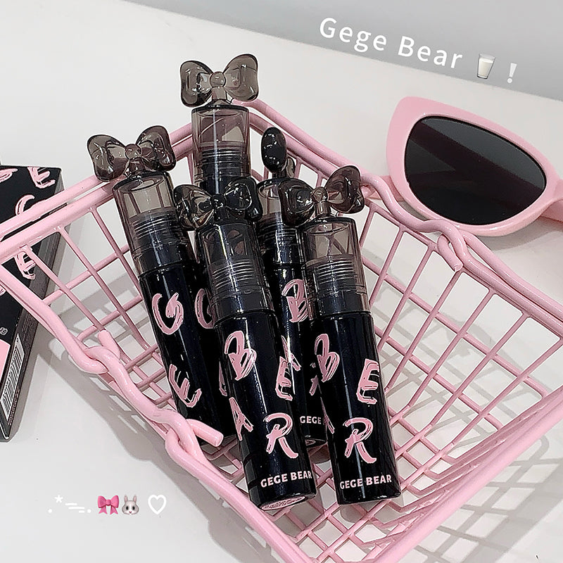 Black lip glosses with 'Gege Bear' branding on a pink grid background