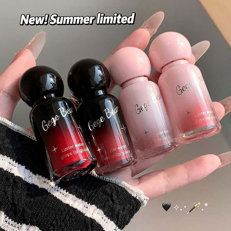 Four small bottles of 'Gege Bear' lip gloss held in a hand with text 'New! Summer limited'.