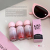 Set of Gaga Bear water gloss lip glazes with packaging and sunglasses on a light background