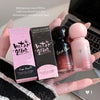 Hand holding two lip gloss boxes and two lip gloss bottles with 'Gege Bear' branding.