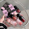 Nail polish bottles and boxes with 'Geege Bear' branding on a metal tray.