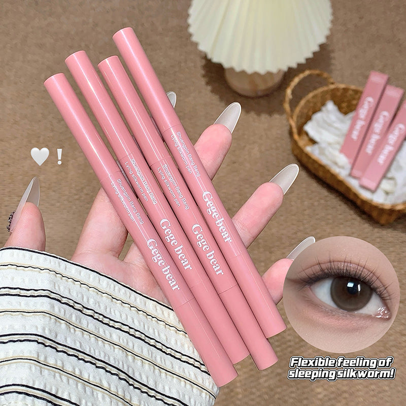 Pink lip pencils held by a hand with an inset of an eye wearing the product.