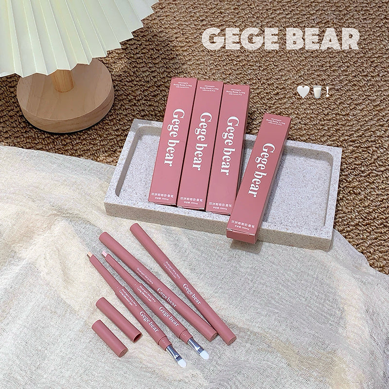 Pink lip pencils and packaging with 'GEGE BEAR' branding on a textured surface.