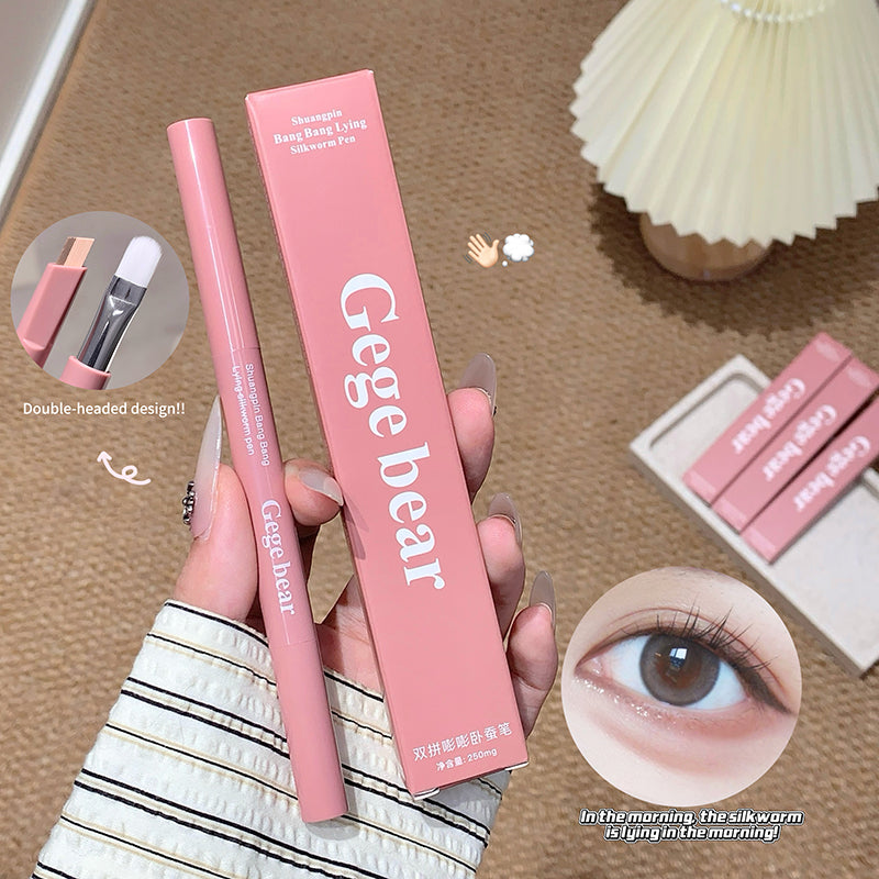 Pink eyeliner pen and packaging with 'Gege bear' branding on a brown surface.