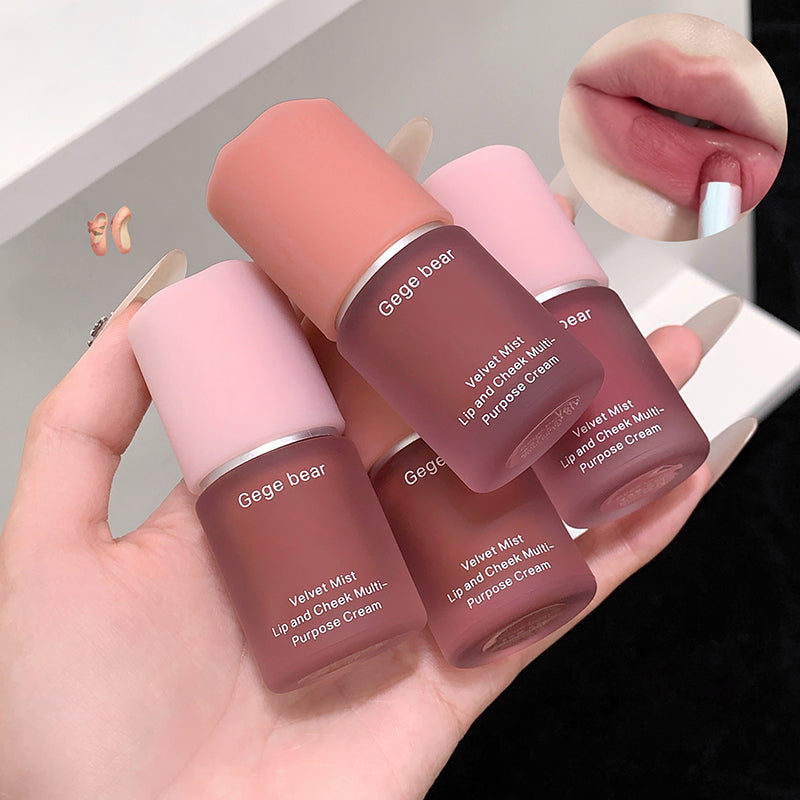 Hand holding four Gege bear lip and cheek multi-purpose creams with close-up of lips.