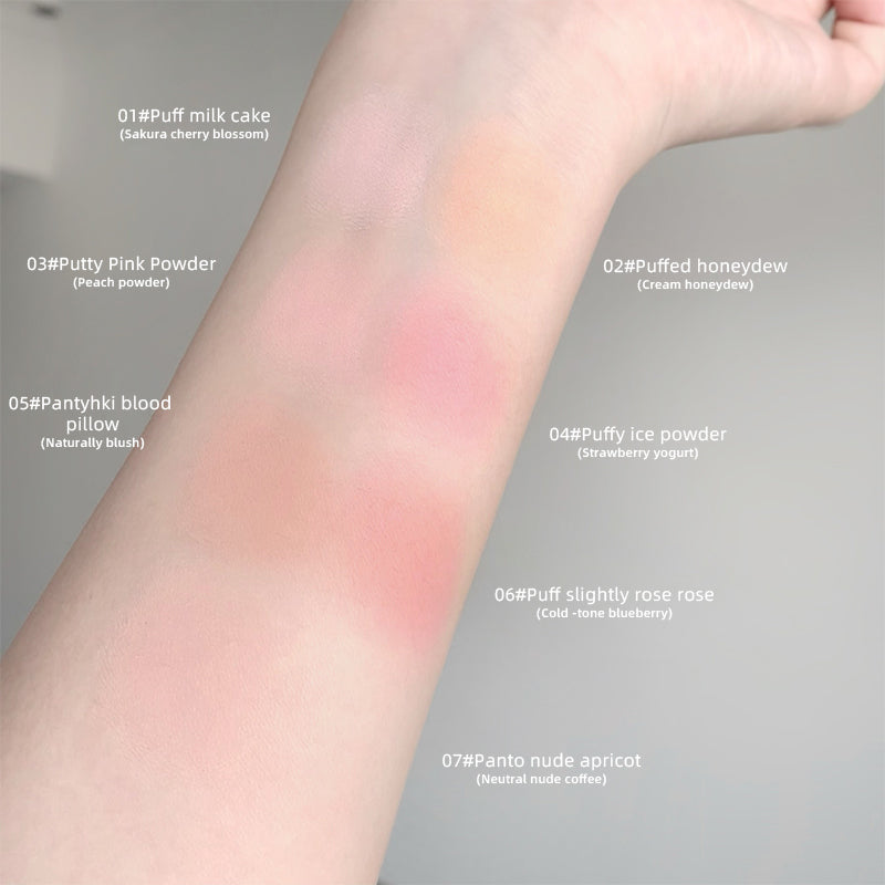 Arm swatches of different blush colors on a neutral background