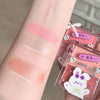 Makeup product with swatches on arm and packaging featuring a cute design.