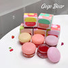 Pink lip balm products with Gege Bear packaging on a white surface