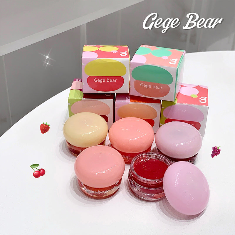 Pink lip balm products with Gege Bear packaging on a white surface