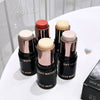 Set of GEGE BEAR light water makeup sticks on a white surface with a blurred background.