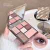 Makeup palette with eyeshadows and a close-up of an eye with makeup, on a neutral background.