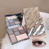 Makeup palette with a mirror and a close-up of an eye wearing the makeup.