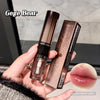 Two lipsticks held in a hand with a blurred background, featuring the brand 'Gege Bear'.