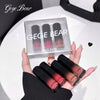 Hand holding GEGE BEAR lipsticks with packaging in the background
