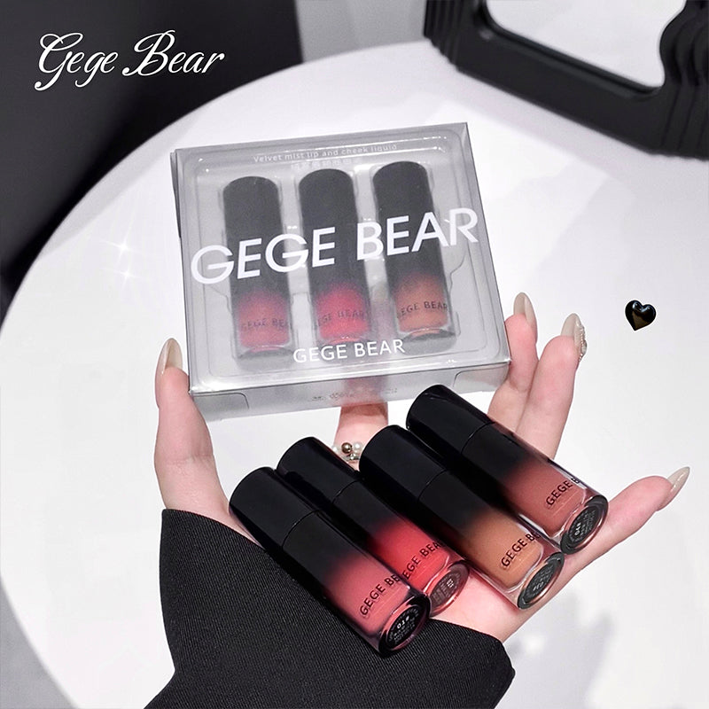 Hand holding GEGE BEAR lipsticks with packaging in the background