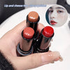 Hand holding three lipsticks with close-up inset of a person wearing red lipstick.