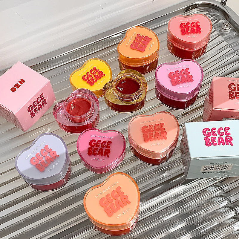 Heart-shaped containers with 'Gee Ge Bear' text on a metallic surface