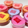 Heart-shaped lip jelly containers with 'GEGE BEAR' branding on a white background