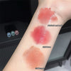 Three different shades of lipstick swatched on a person's arm with labels.