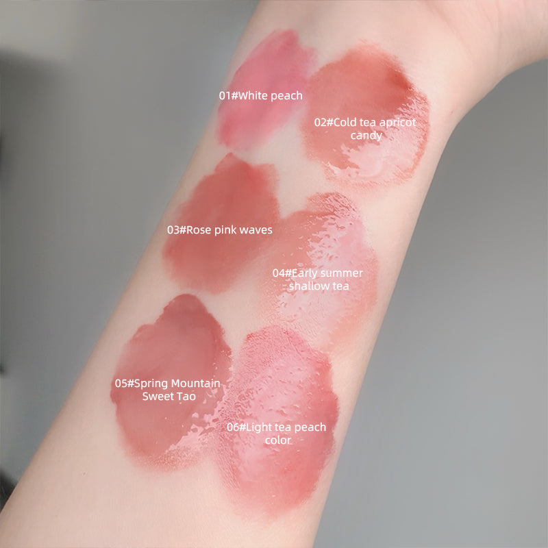 Lipstick swatches on a person's arm with color names labeled