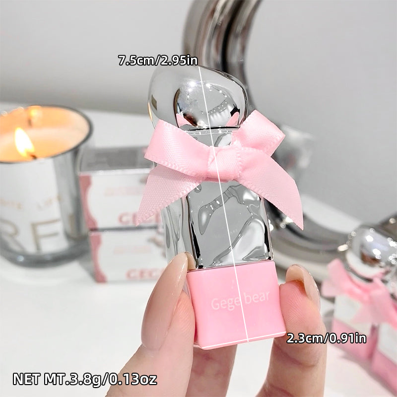Small silver bottle with pink bow and packaging held by a hand, with measurements and product details displayed.