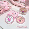 Pink makeup products with cartoon character design on a white surface, featuring the brand 'Gege bear'.