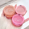 GE GE BEAR blushes in various shades held by a hand against a light background