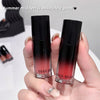 Two lip products with black and red gradient held by a hand, labeled 'GEGE BEAR'.