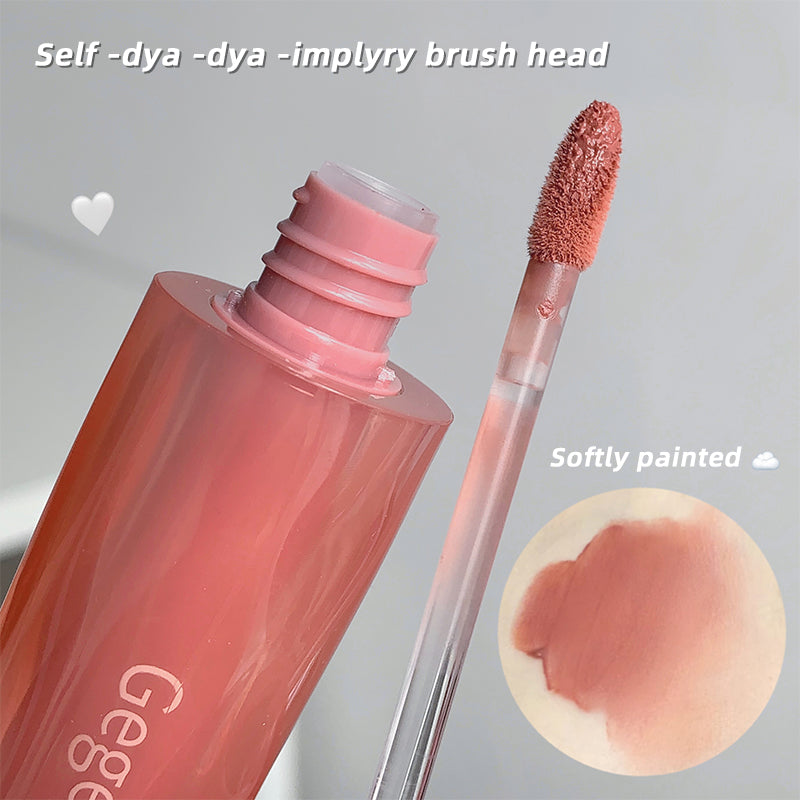 Pink lip gloss with brush and color swatch on a gray background