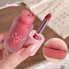 Pink lipstick with 'Gege bear' branding, applied on lips.