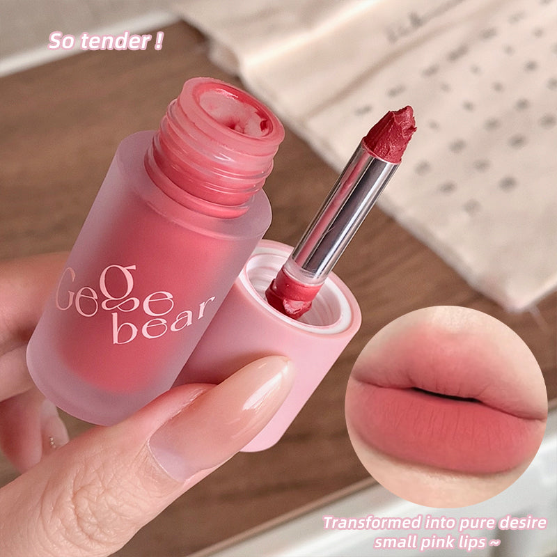 Pink lipstick with 'Gege bear' branding, applied on lips.