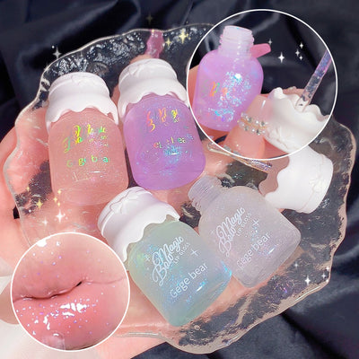 Set of small bottles with colorful contents and visible branding on a dark background.