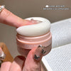 Pink compact with white puff held by a hand, labeled 'Gege beat'.