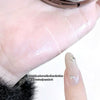 Hand applying oil to skin with text indicating instant matte effect