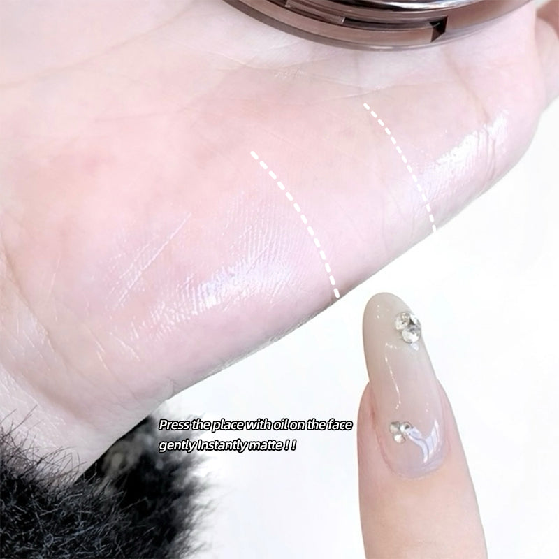 Hand applying oil to skin with text indicating instant matte effect