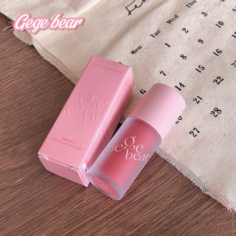 Pink cosmetic product with 'Gege bear' branding on a wooden surface and calendar background.