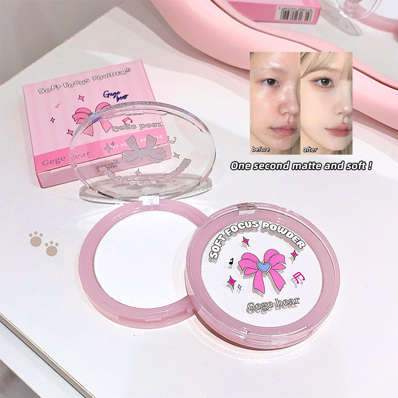 Pink makeup compact with 'Geege' branding on a white background